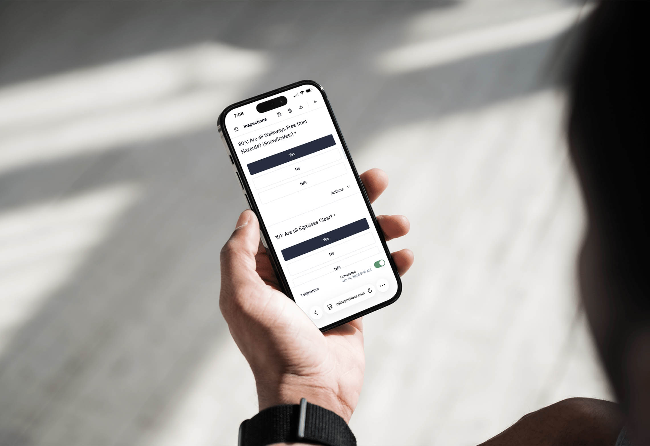 Person holding a mobile phone