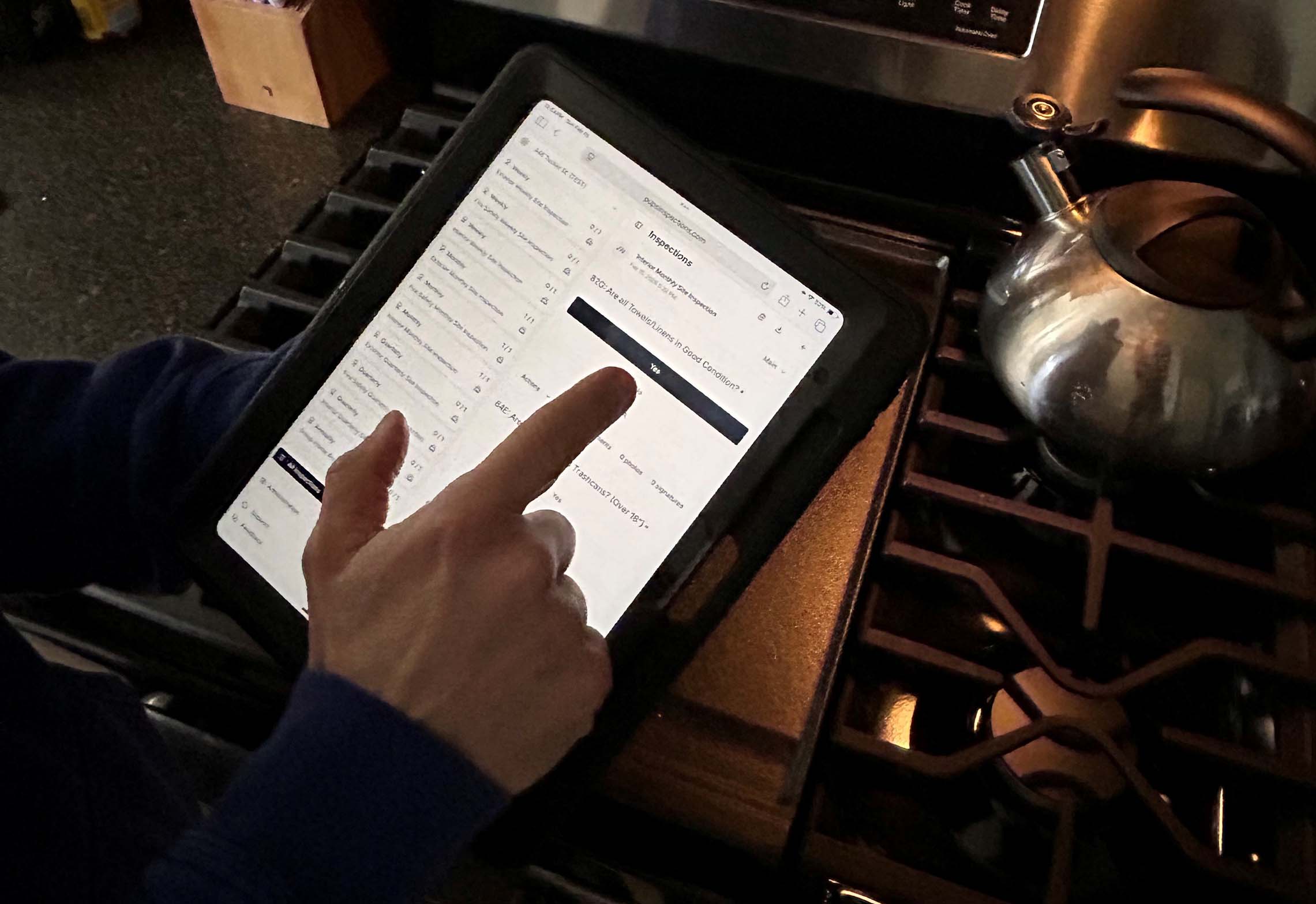 A digital tablet screen displaying a checklist titled Inspections