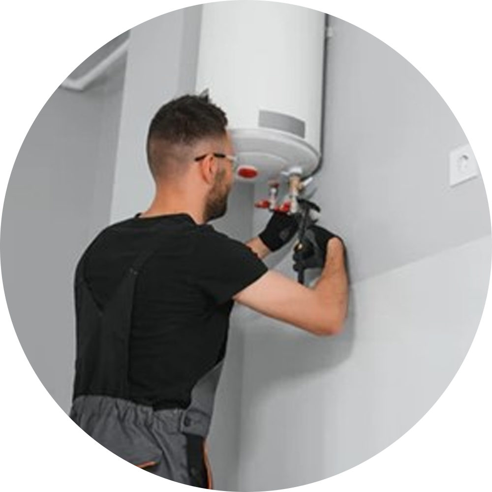 A professional technician installing a wall-mounted electric water heater